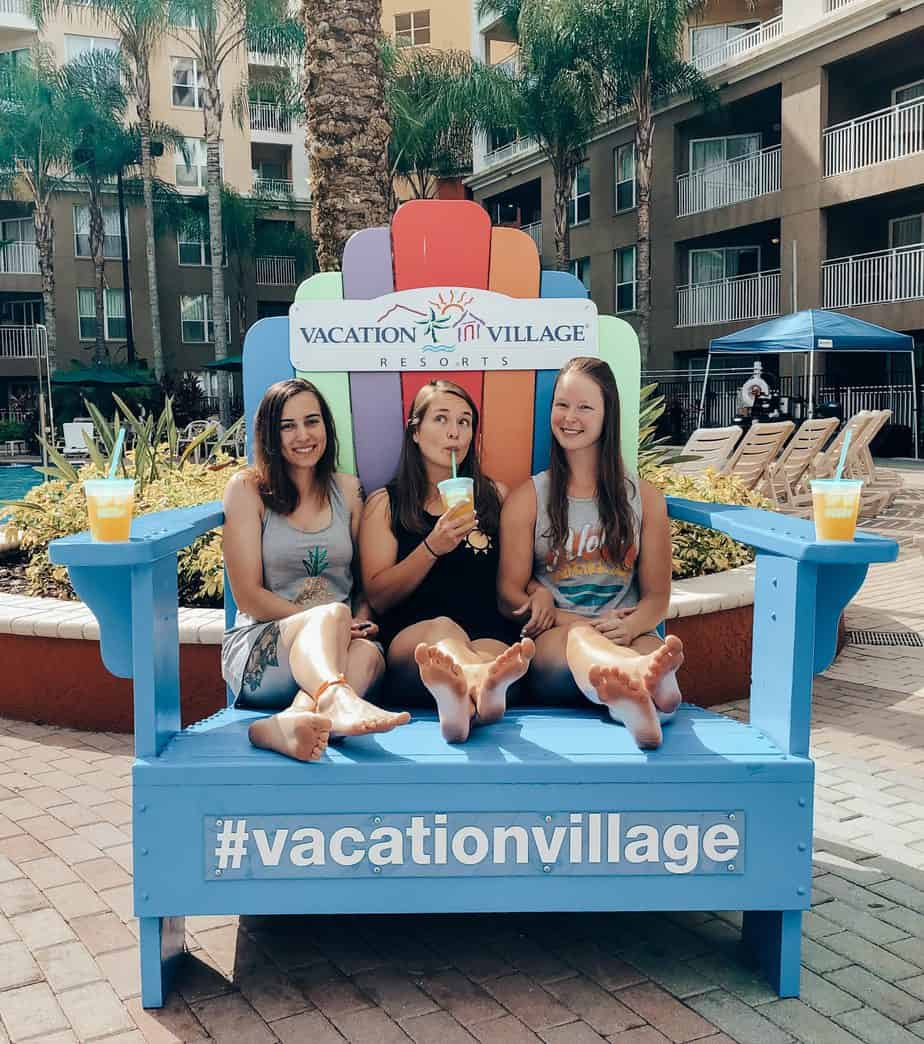 Me and three friends in a giant beach chair at Vacation Village